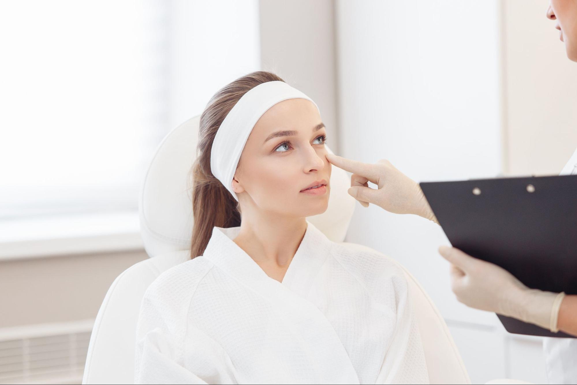 A woman consulting with a specialist about a PDO thread lift procedure.