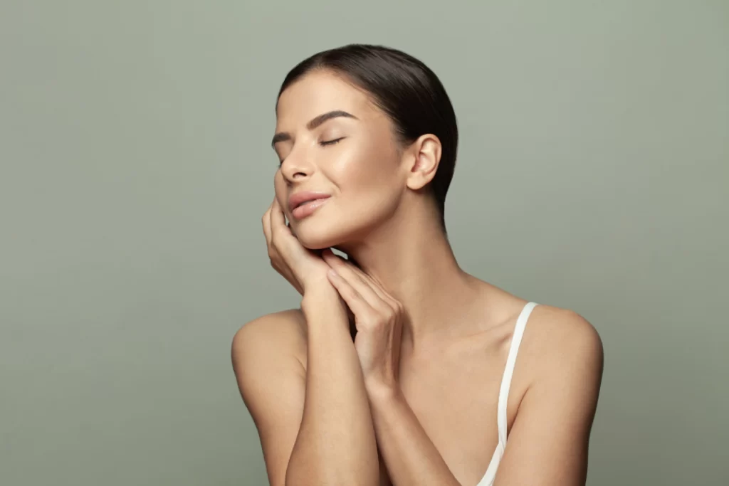 A woman with radiant, smooth skin after a HydraFacial treatment.