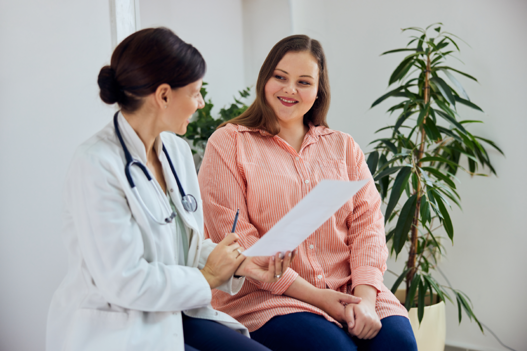 A patient discussing weight loss options with a doctor during a Tirzepatide consultation.