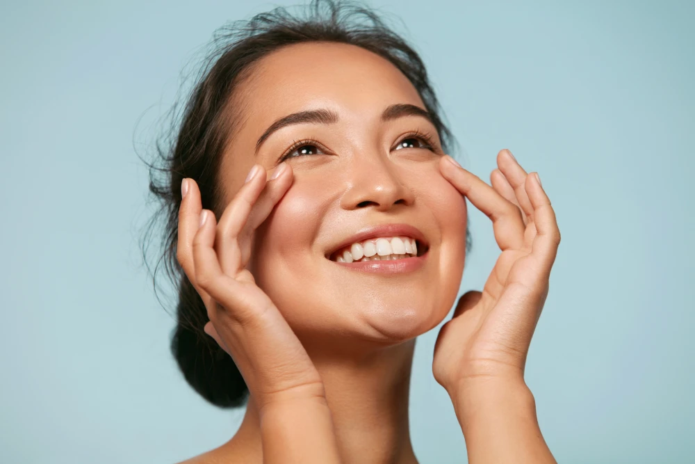 Smiling woman with radiant skin after Morpheus8 treatment.