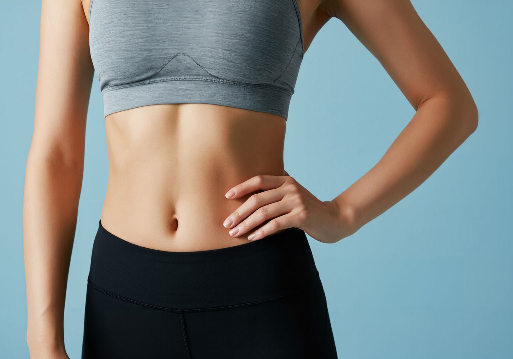 Flat stomach and toned waist as a result of body contouring.